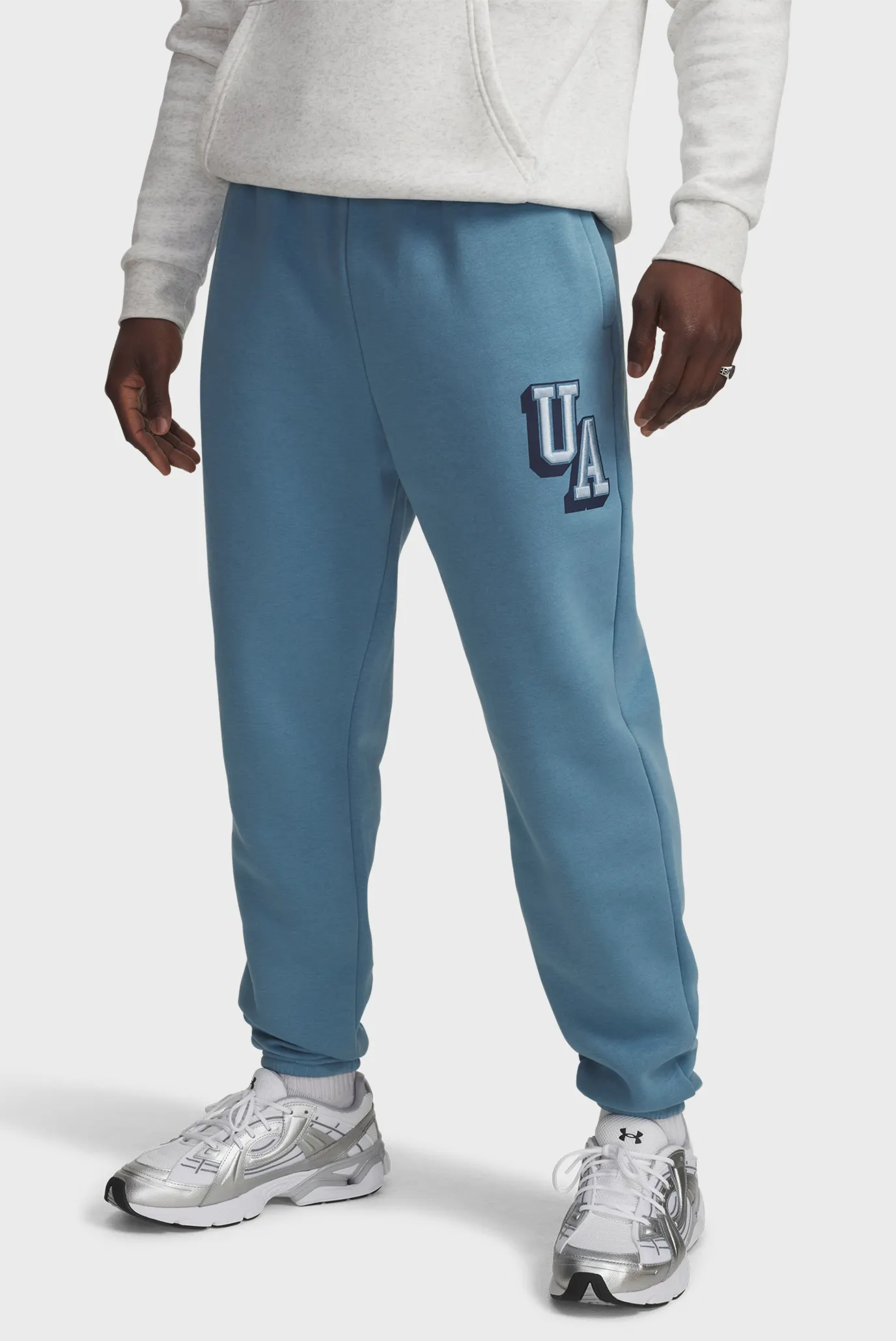 Чоловічі блакитні спортивні штани UA Icon Flc Graphic Jgr 1