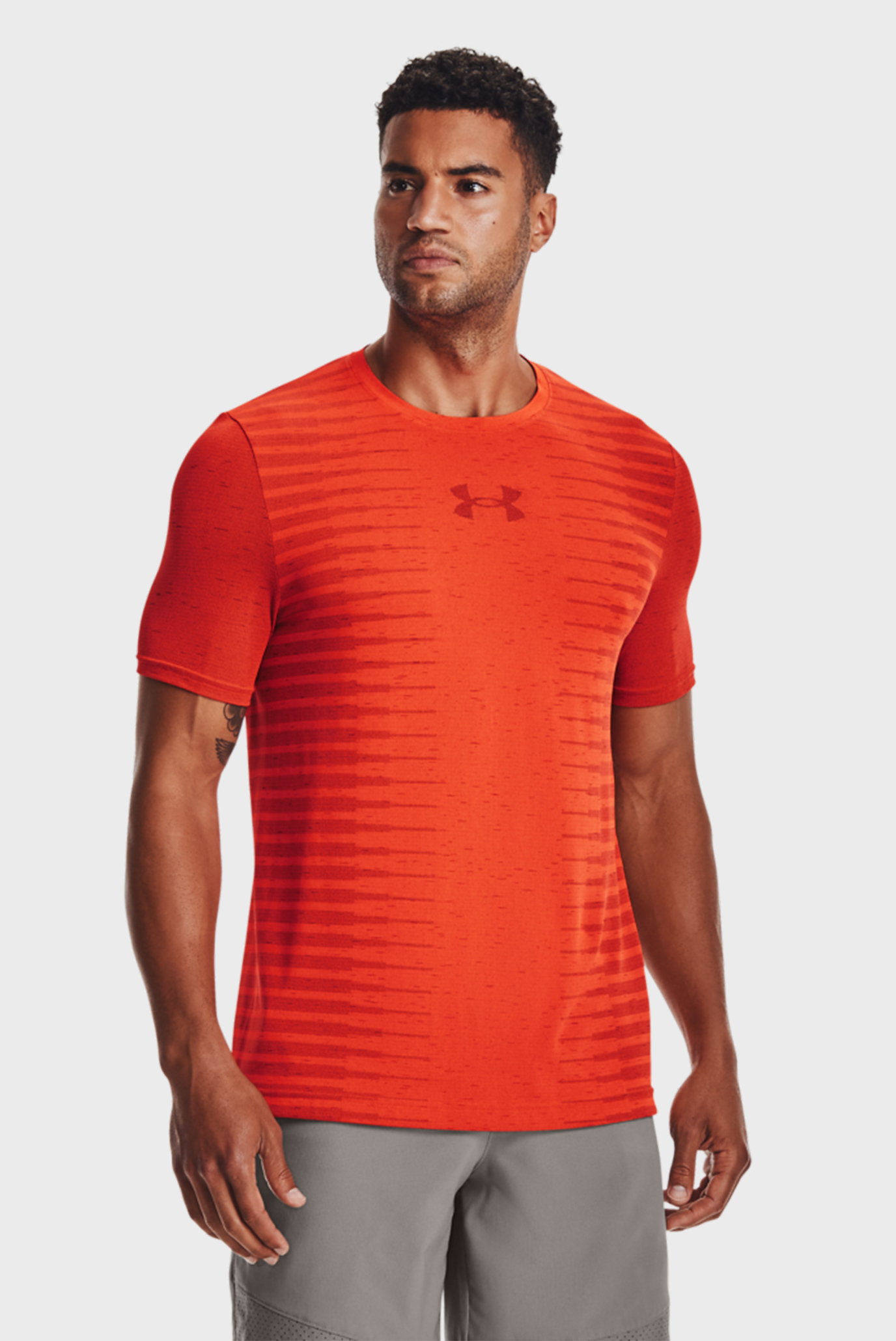 Мужская оранжевая футболка UA Seamless Wordmark SS 1