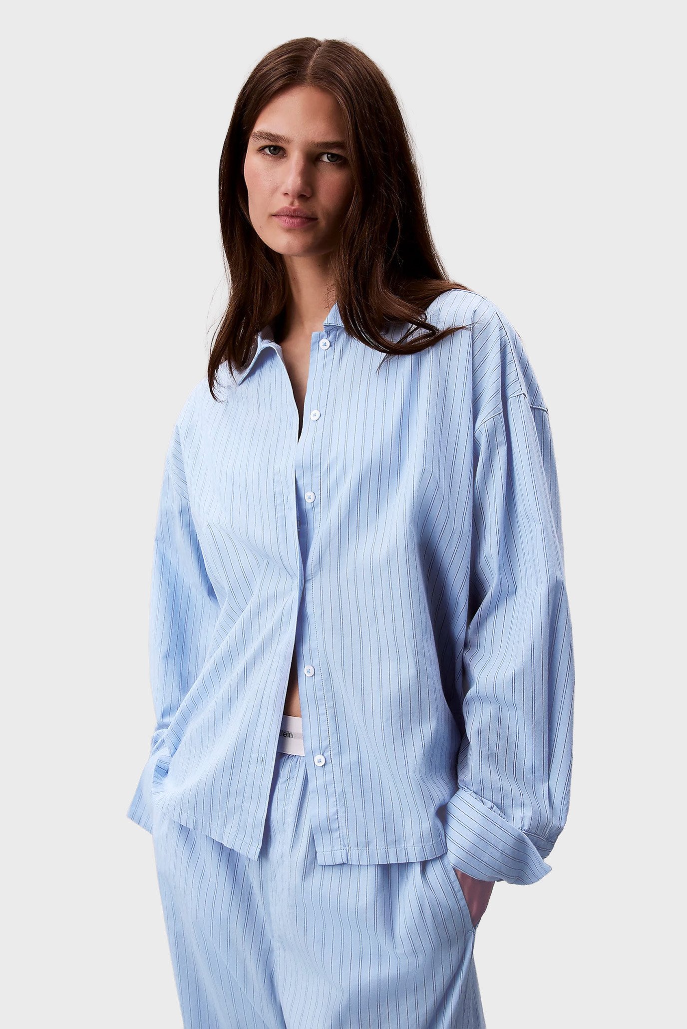 Женская голубая рубашка в полоску BUTTON DOWN Голубой L Calvin Klein 000QS7243E Женская голубая рубашка в полоску BUTTON DOWN Голубой L Calvin Klein 000QS7243E