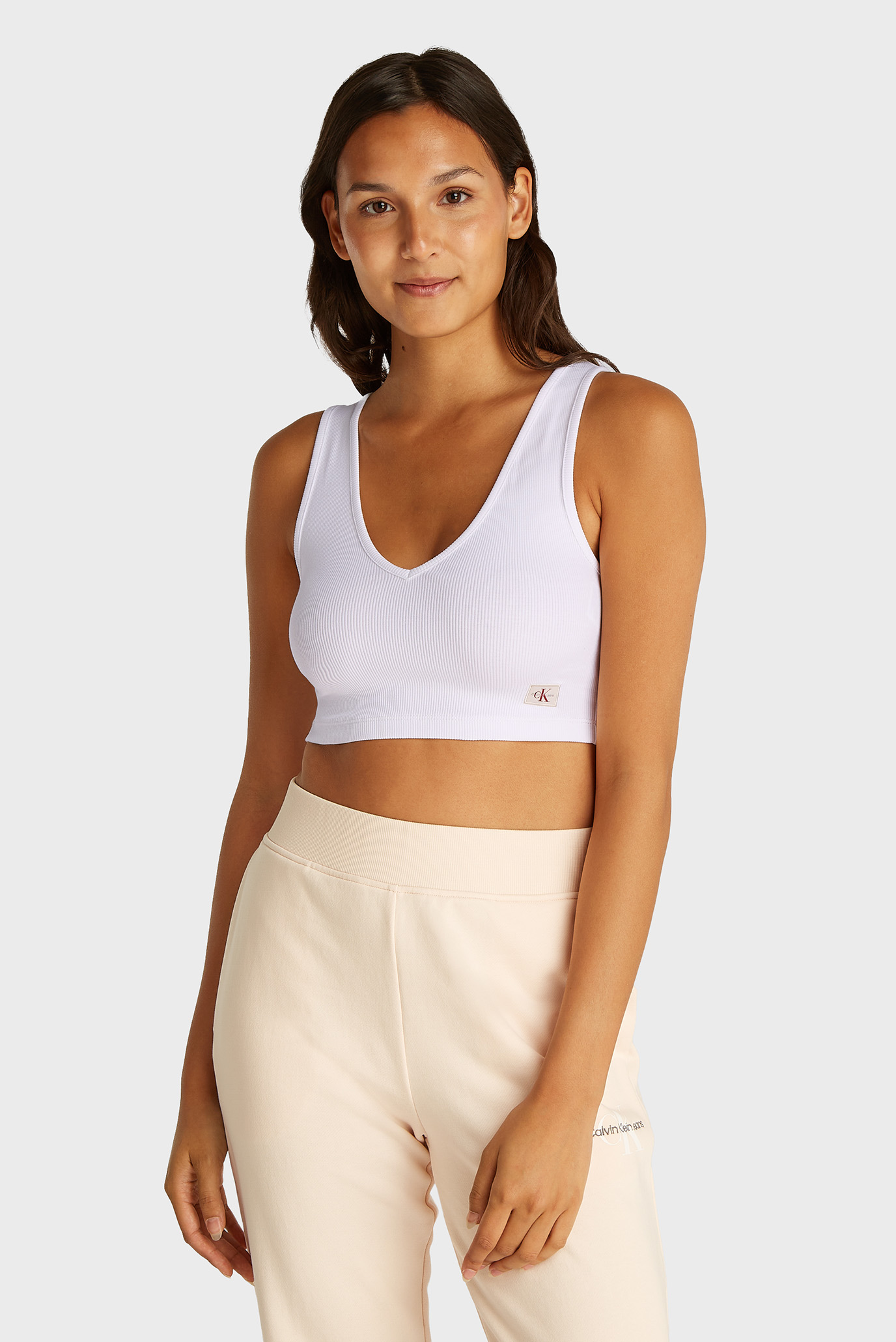 Женский белый топ WOVEN LABEL RIB BRALETTE Белый L Calvin Klein Jeans J20J225308 Женский белый топ WOVEN LABEL RIB BRALETTE Белый L Calvin Klein Jeans J20J225308