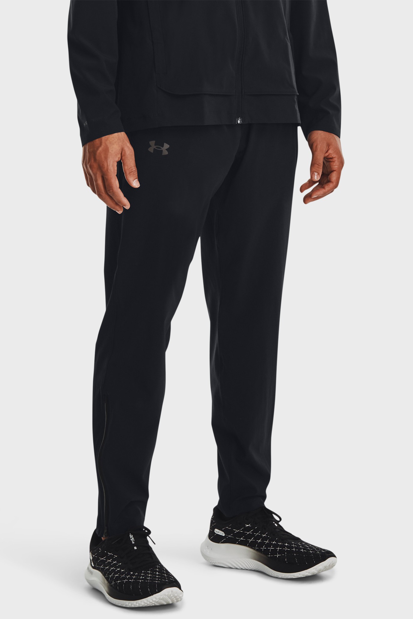 Чоловічі чорні спортивні штани UA OUTRUN THE STORM PANT 1