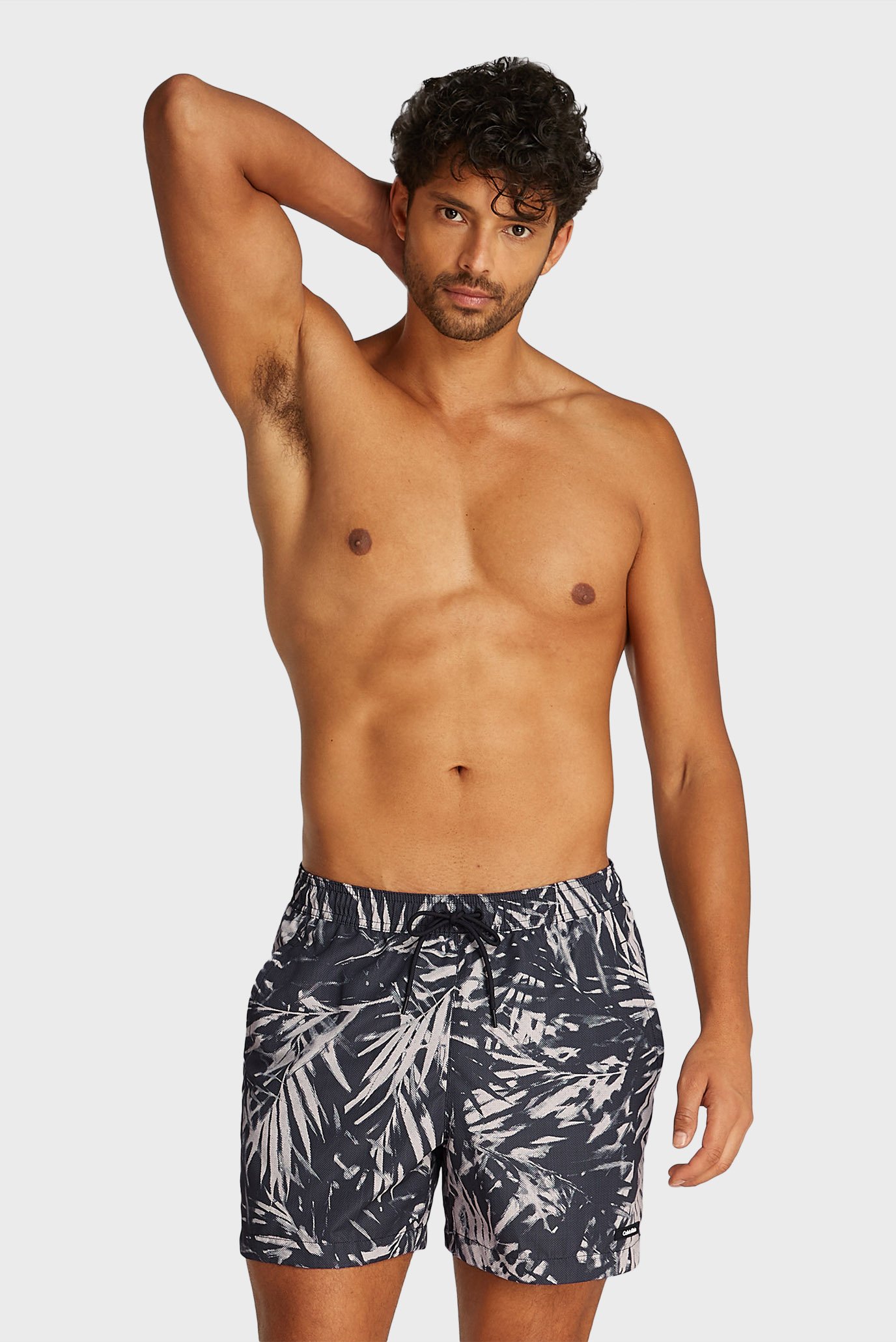 Мужские черные плавательные шорты с узором MEDIUM DRAWSTRING-PRINT Черный L Calvin Klein KM0KM01120 Мужские черные плавательные шорты с узором MEDIUM DRAWSTRING-PRINT Черный L Calvin Klein KM0KM01120