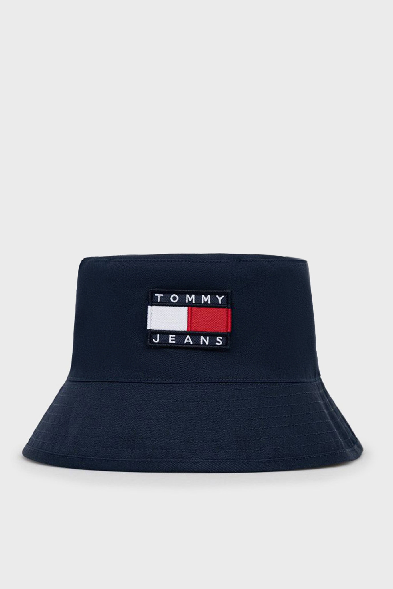 Мужская двусторонняя темно-синяя панама TJM HERITAGE BUCKET REV CP Синий ONESIZE Tommy Jeans AM0AM08497 Мужская двусторонняя темно-синяя панама TJM HERITAGE BUCKET REV CP Синий ONESIZE Tommy Jeans AM0AM08497