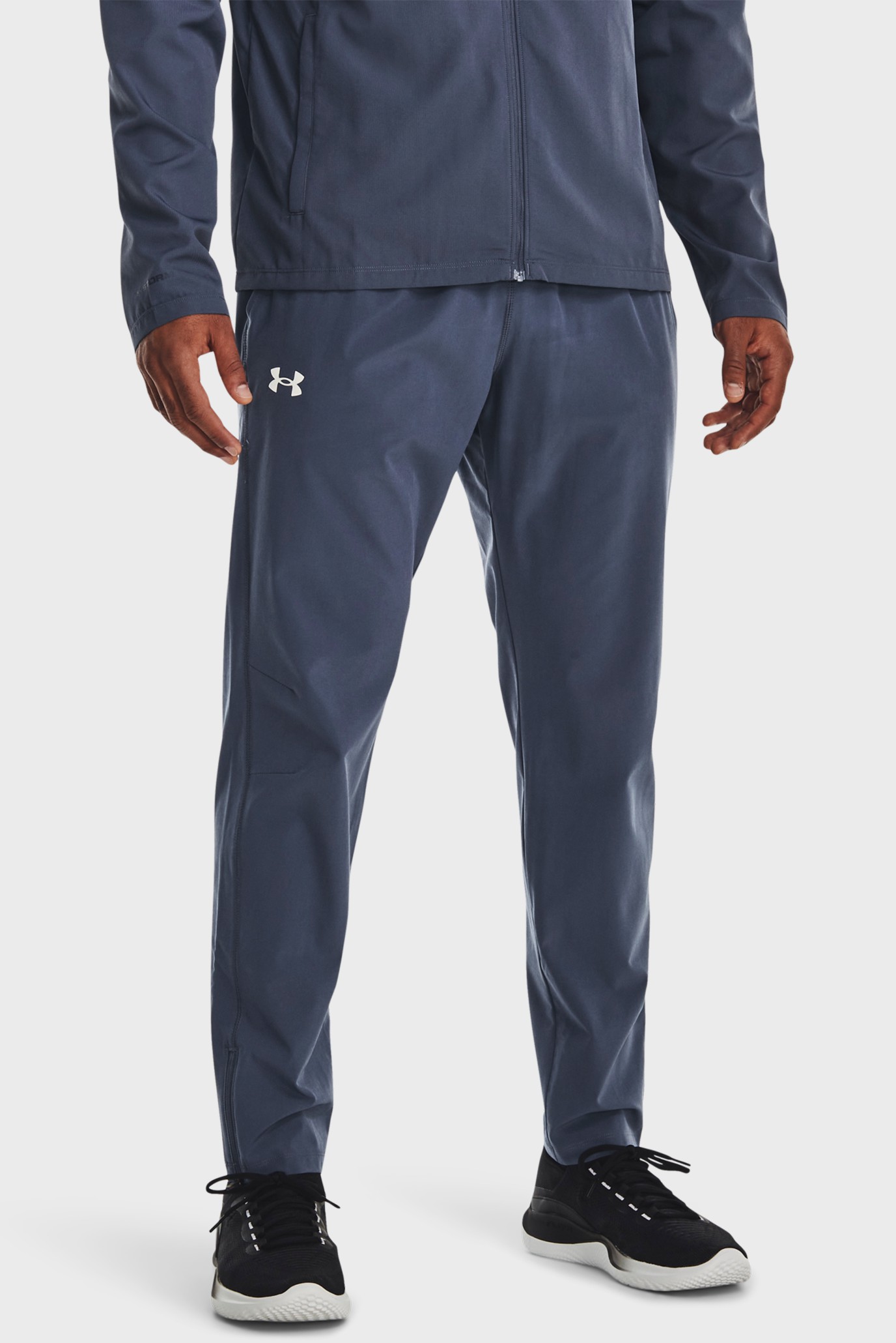 Чоловічі сірі спортивні штани UA STORM RUN PANT 1