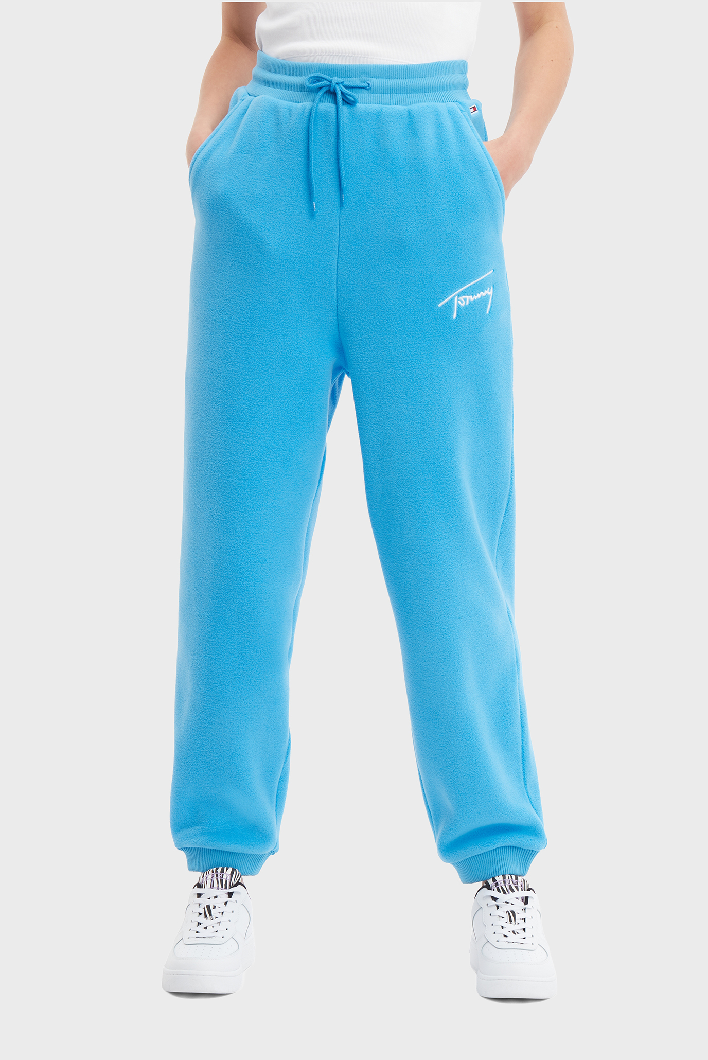 Женские голубые спортивные брюки TJW SIGNATURE FLEECE Голубой M Tommy Jeans DW0DW14435 Женские голубые спортивные брюки TJW SIGNATURE FLEECE Голубой M Tommy Jeans DW0DW14435
