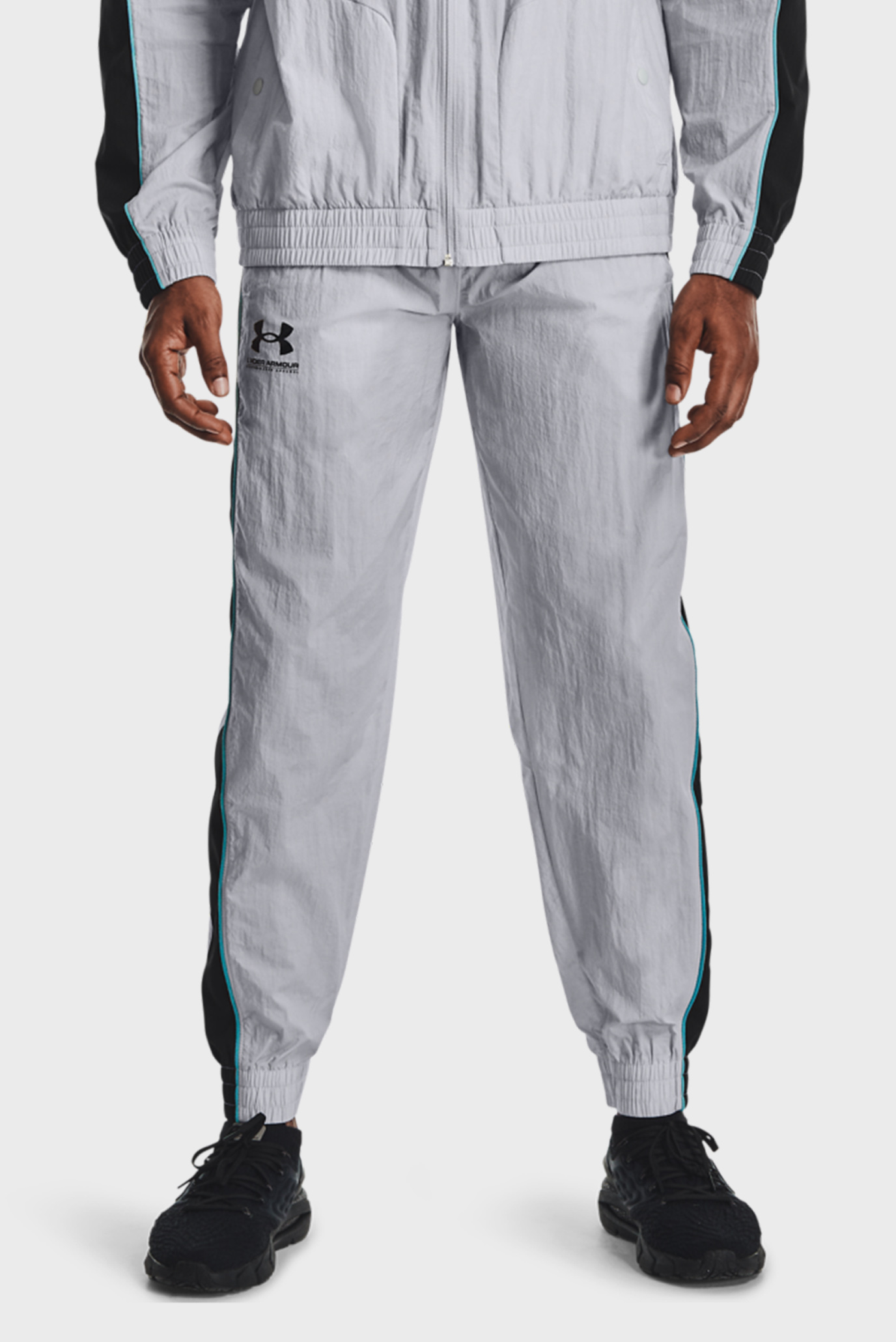 Чоловічі сірі спортивні штани UA WOVEN TRACK PANT 1