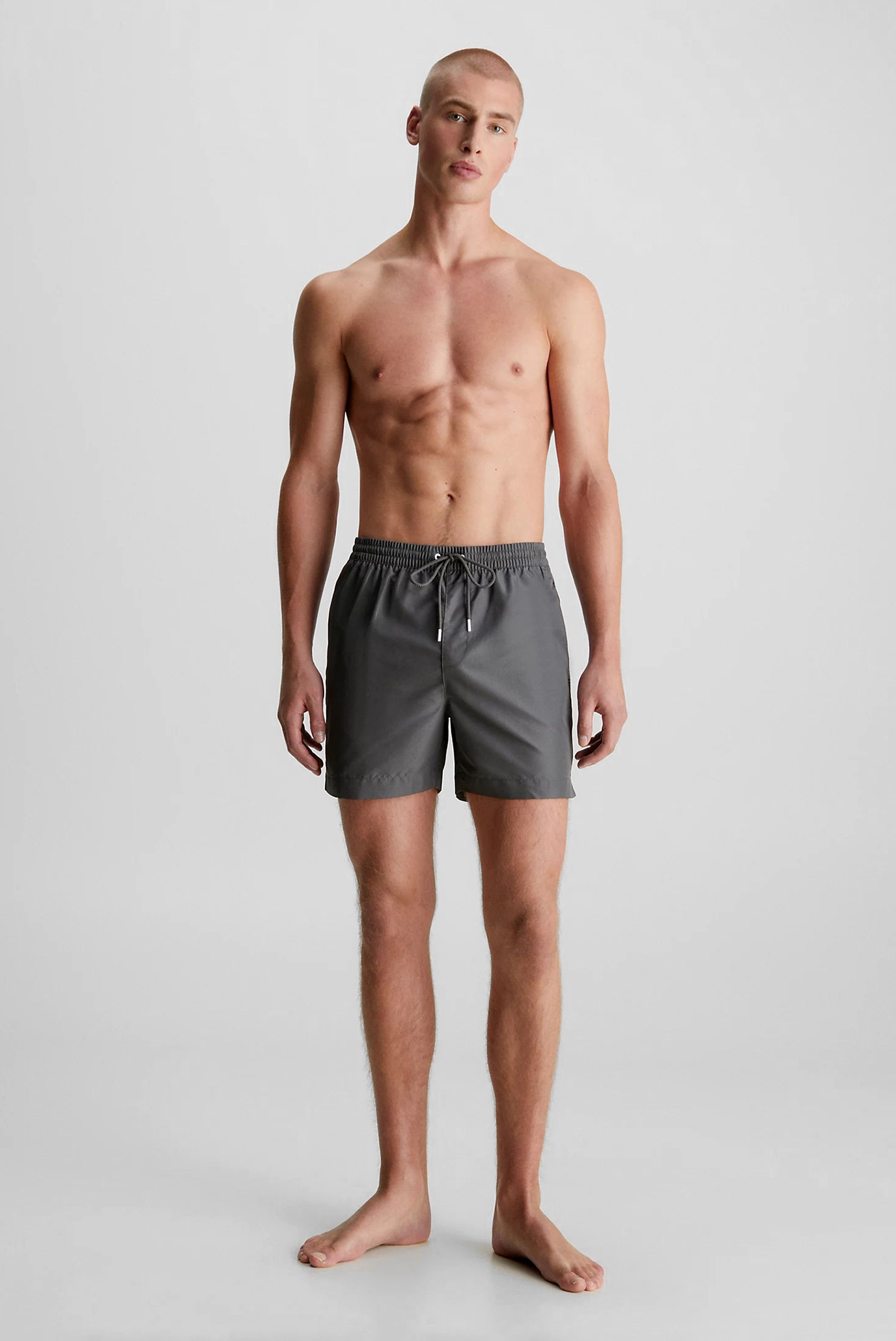 Мужские серые плавательные шорты MEDIUM DRAWSTRING Серый XL Calvin Klein KM0KM00810 Мужские серые плавательные шорты MEDIUM DRAWSTRING Серый XL Calvin Klein KM0KM00810