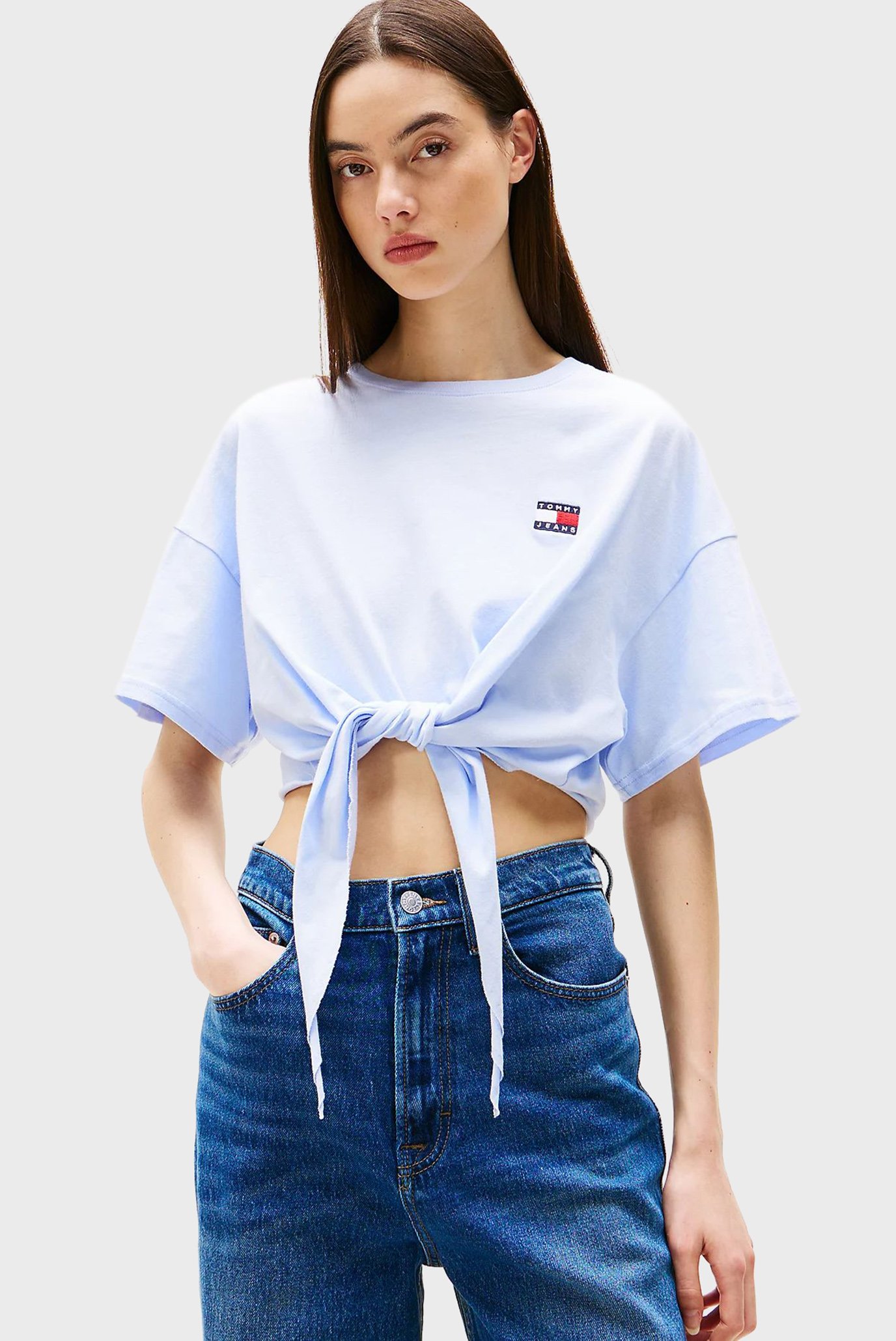 Женская голубая футболка TJW REG WAIST TIE BADGE Голубой S Tommy Jeans DW0DW20321 Женская голубая футболка TJW REG WAIST TIE BADGE Голубой S Tommy Jeans DW0DW20321