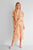 Женское персиковое платье с узором