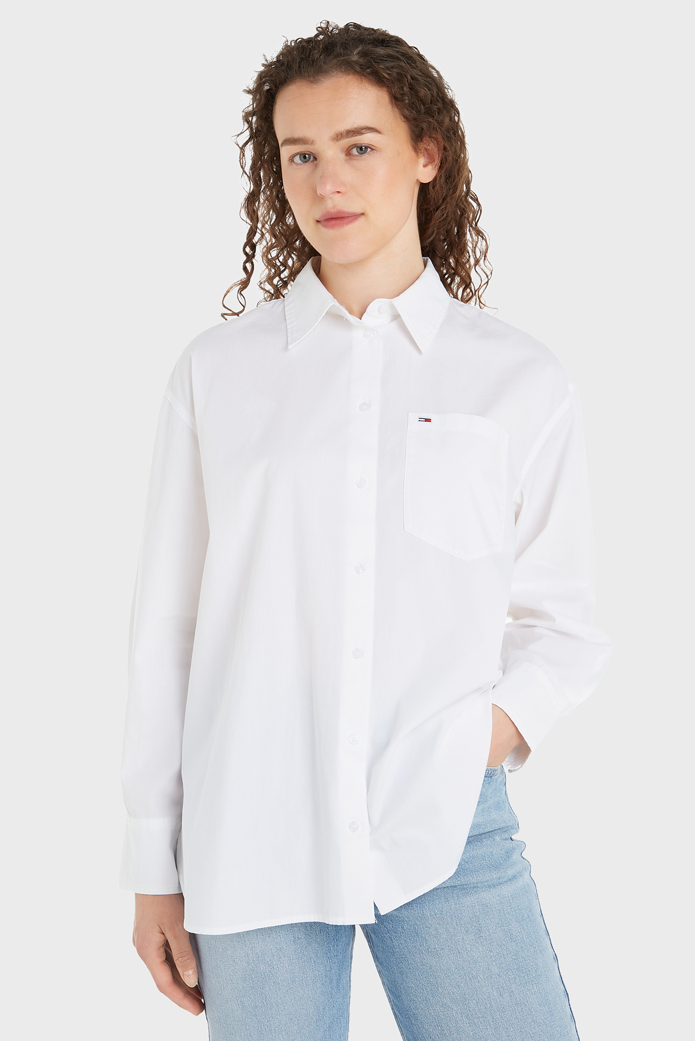 Женская белая рубашка TJW RLX ESSENTIAL Белый S Tommy Jeans DW0DW18455 Женская белая рубашка TJW RLX ESSENTIAL Белый S Tommy Jeans DW0DW18455