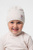 Детская персиковая шапка в полоску