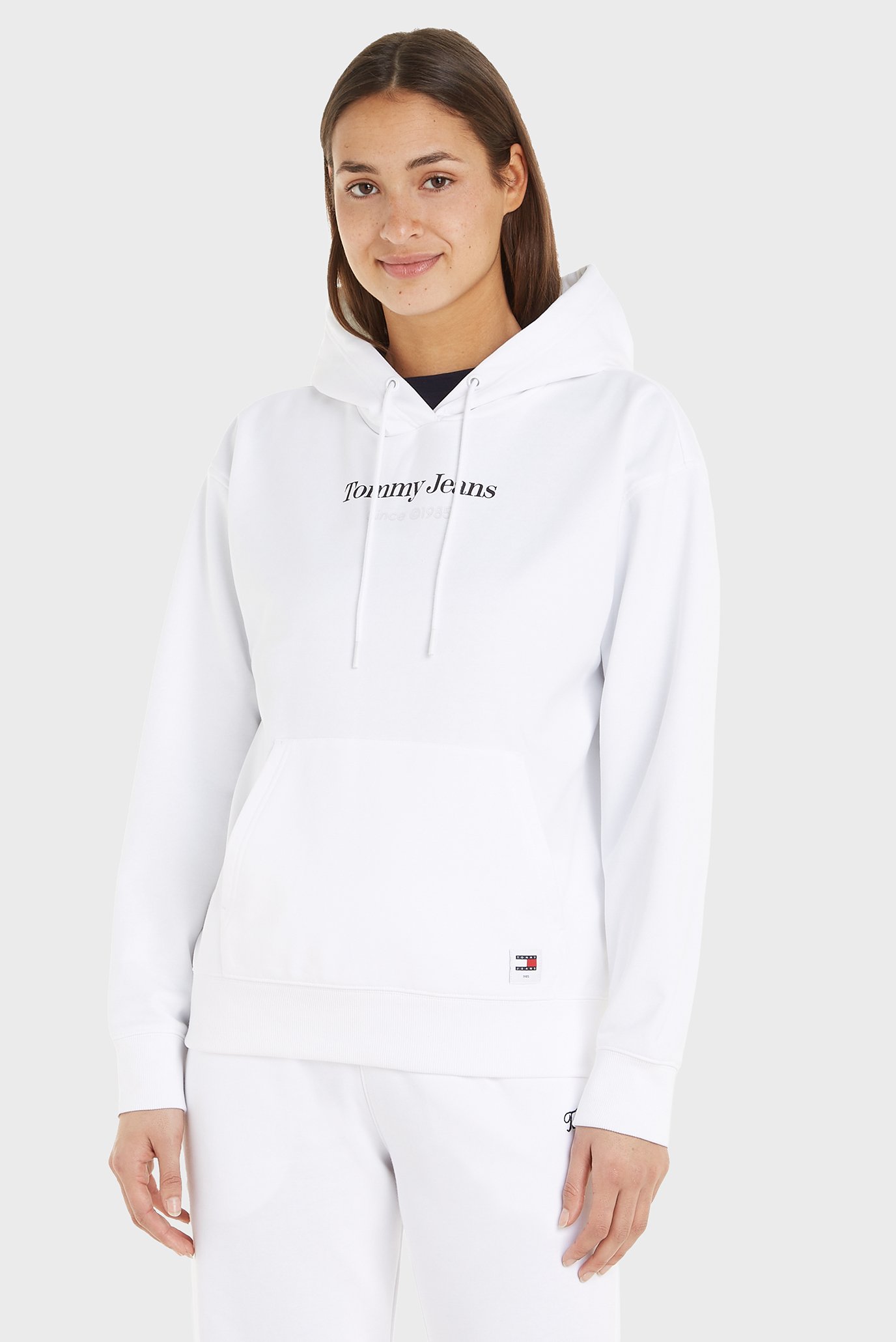 Женское белое худи TJW RLX ESSENTIAL Белый L Tommy Jeans DW0DW17331 Женское белое худи TJW RLX ESSENTIAL Белый L Tommy Jeans DW0DW17331