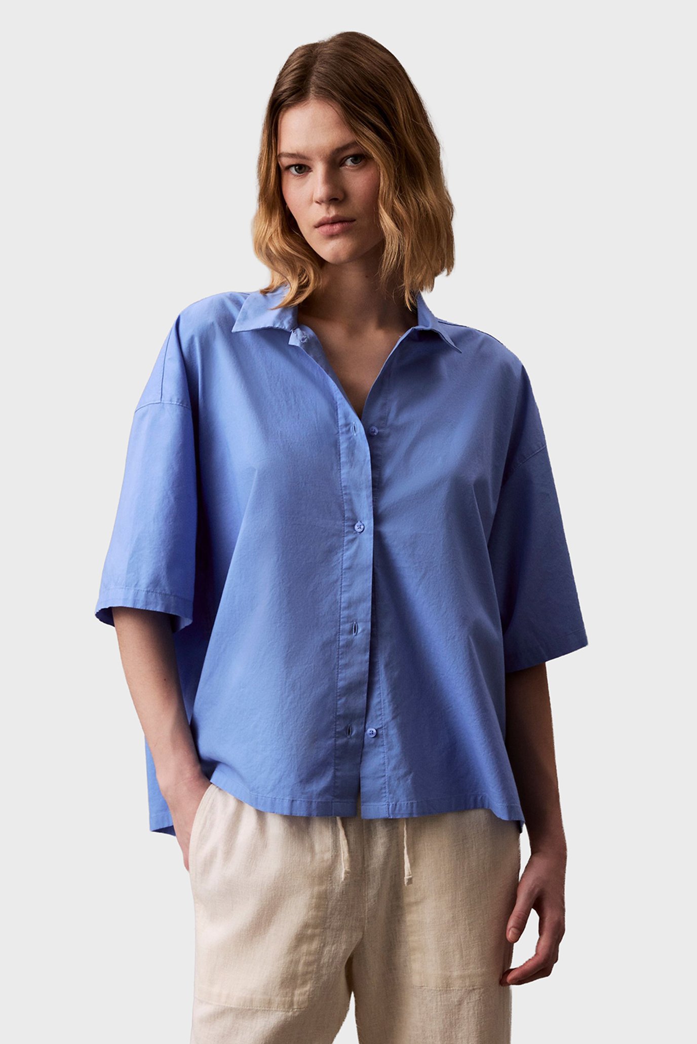 Женская голубая рубашка S/S BUTTON DOWN Голубой S Calvin Klein 000QS7314E Женская голубая рубашка S/S BUTTON DOWN Голубой S Calvin Klein 000QS7314E