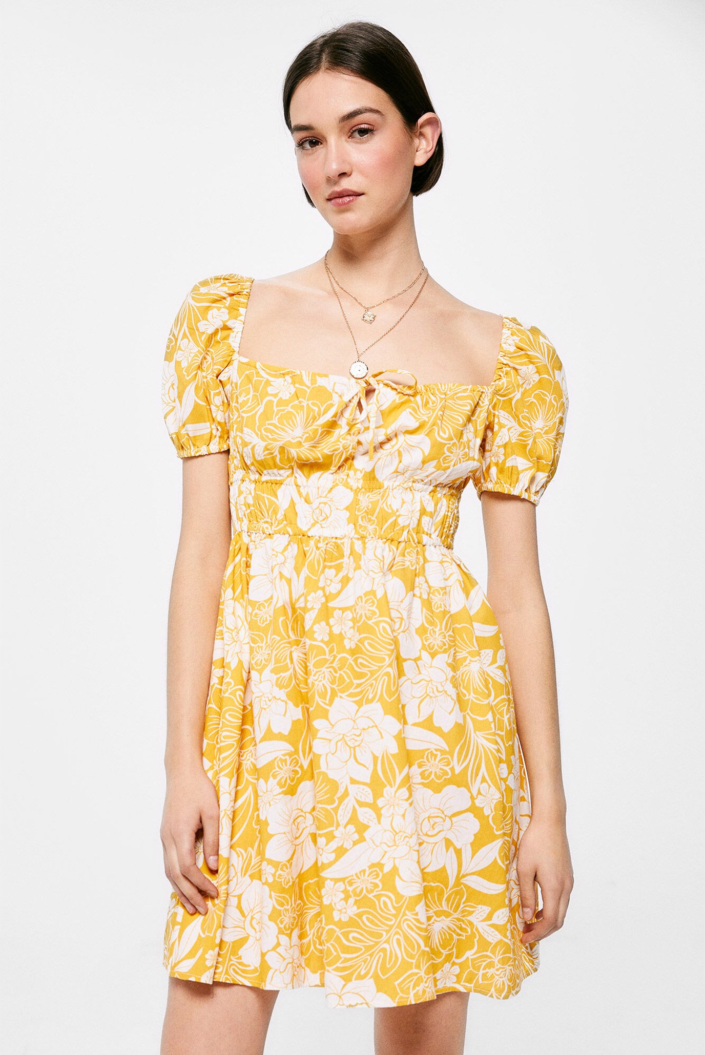 Жіноча жовта сукня з візерунком 1