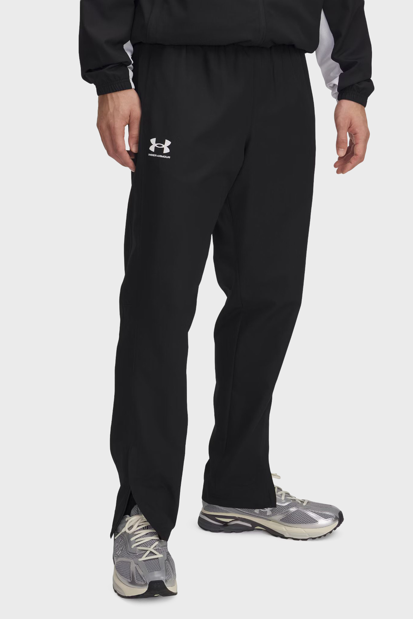 Мужские черные спортивные брюки UA Rival Wvn Windbreaker Pnt Черный M Under Armour 1390150-001 Мужские черные спортивные брюки UA Rival Wvn Windbreaker Pnt Черный M Under Armour 1390150-001