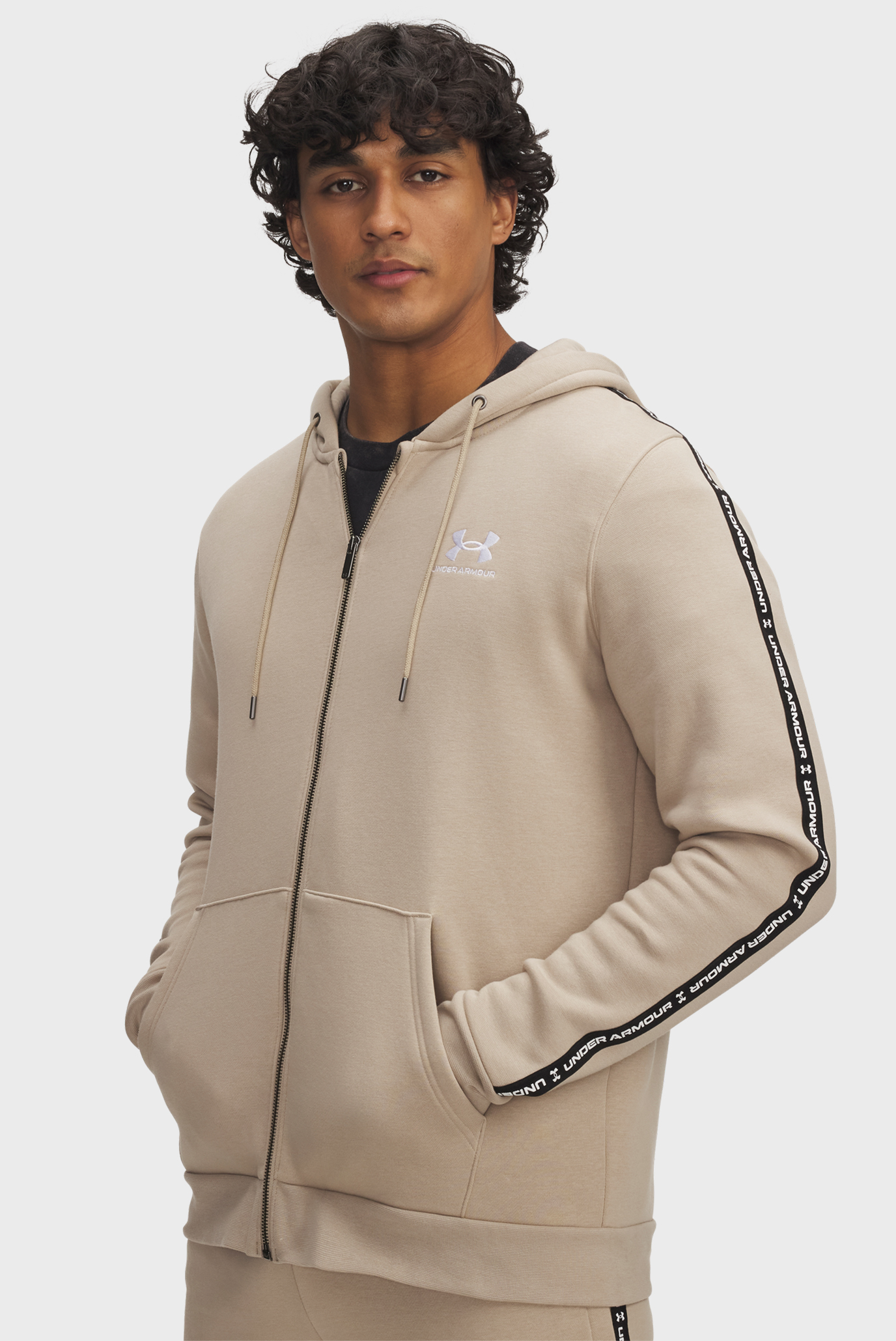 Мужское бежевое худи UA Icon Fleece FZ Taping Бежевый XL Under Armour 1390298-299 Мужское бежевое худи UA Icon Fleece FZ Taping Бежевый XL Under Armour 1390298-299