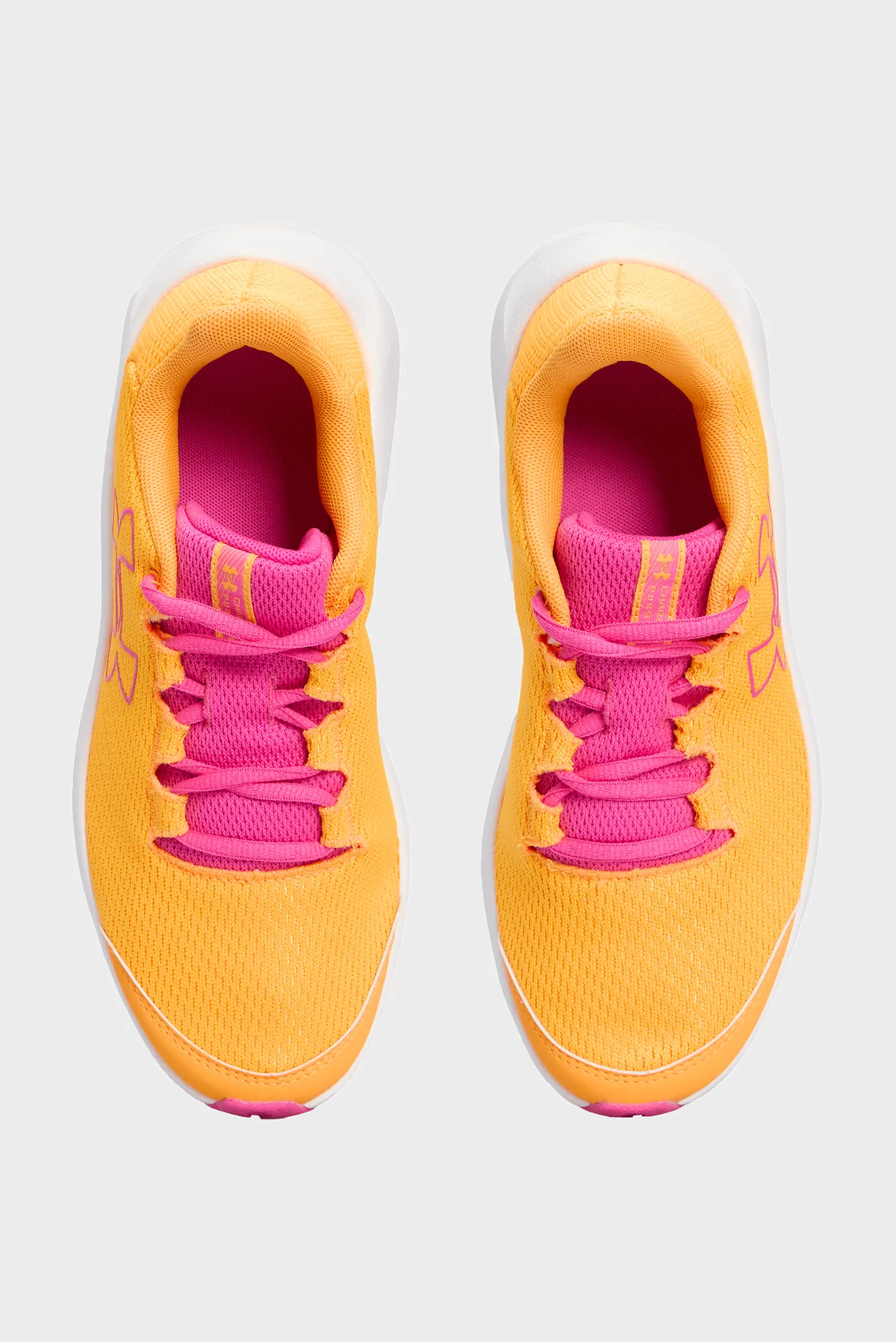 Дитячі помаранчеві кросівки UA GGS Charged Pursuit 3 BL 4