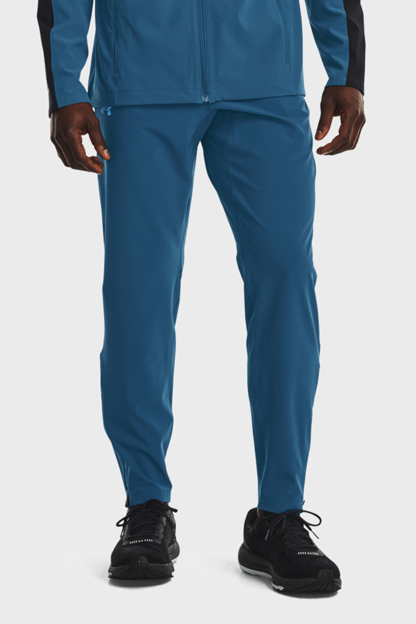 Мужские синие спортивные брюки UA OutRun the STORM Pant 1