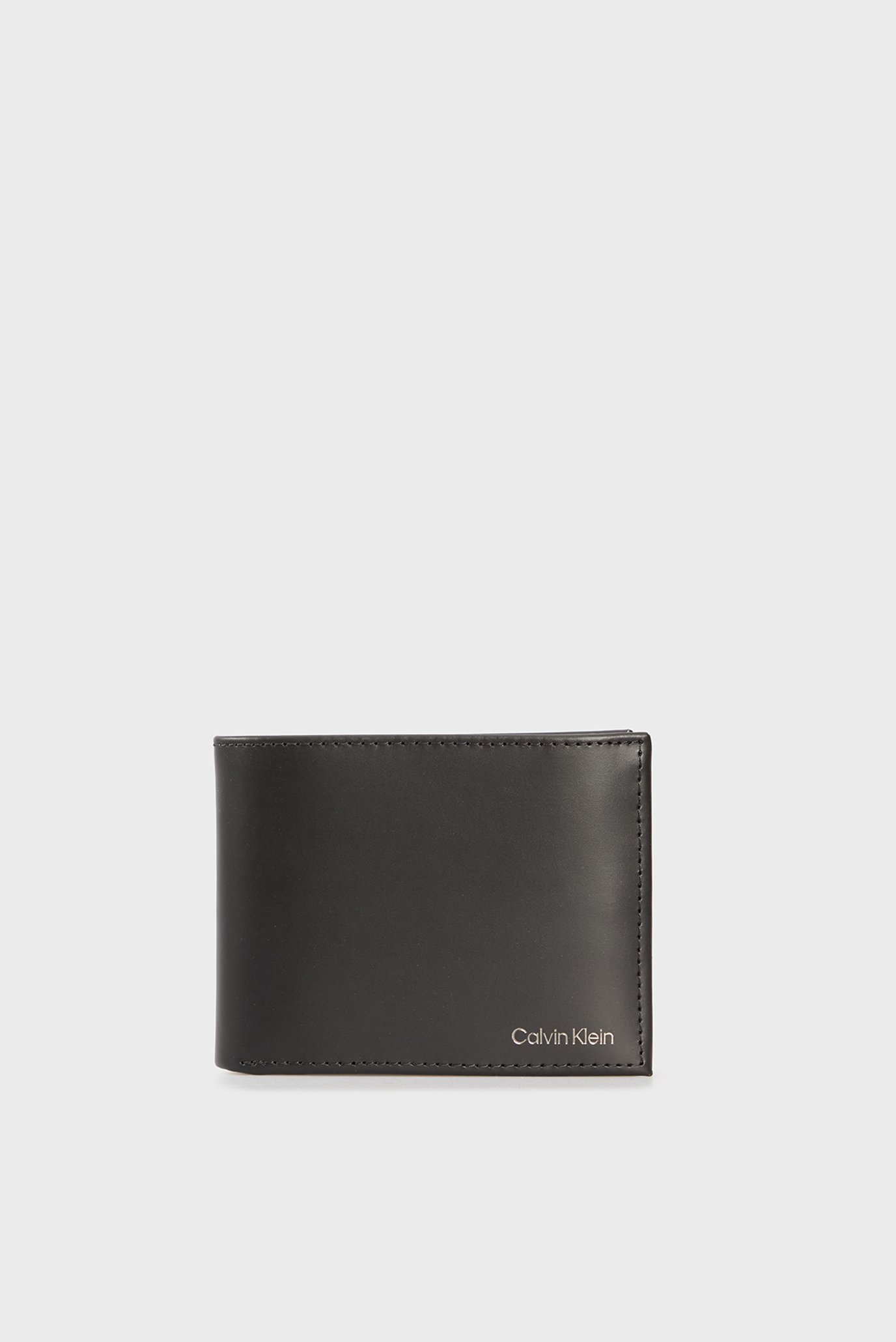 Мужской черный кожаный кошелек SMOOTH Черный ONESIZE Calvin Klein LV04D1105G Мужской черный кожаный кошелек SMOOTH Черный ONESIZE Calvin Klein LV04D1105G