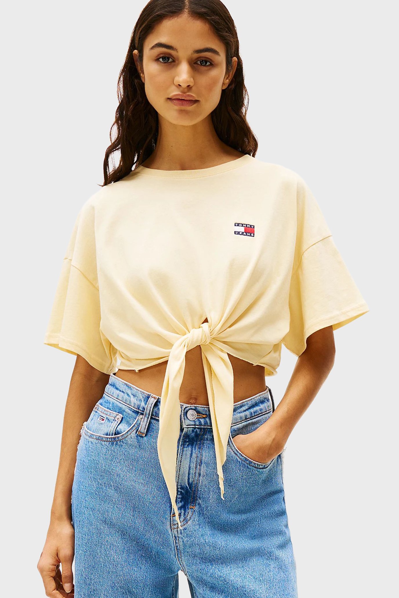 Женская желтая футболка TJW REG WAIST TIE BADGE Желтый M Tommy Jeans DW0DW20321 Женская желтая футболка TJW REG WAIST TIE BADGE Желтый M Tommy Jeans DW0DW20321