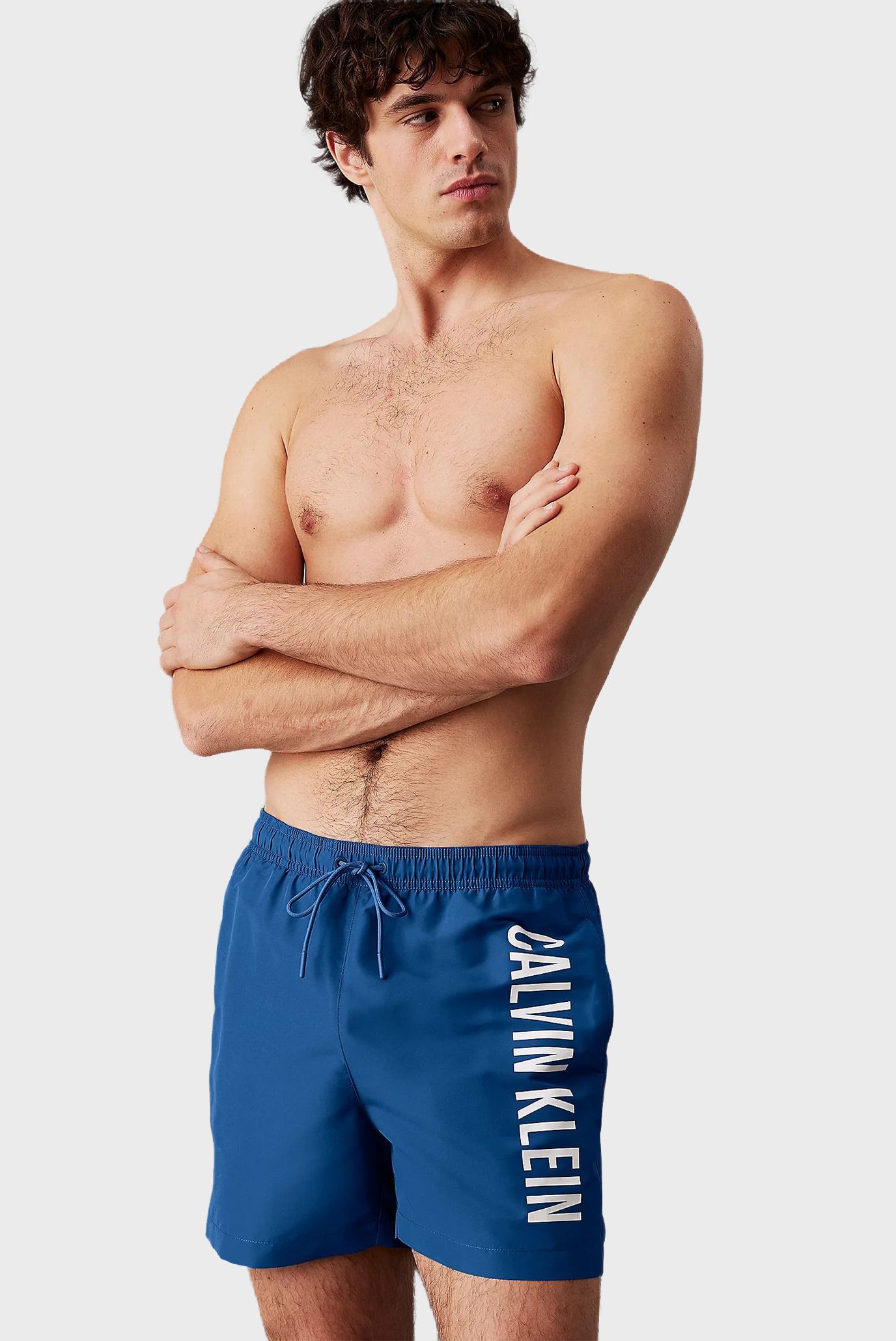 Мужские синие плавательные шорты MEDIUM DRAWSTRING Синий XL Calvin Klein LV00N61092 Мужские синие плавательные шорты MEDIUM DRAWSTRING Синий XL Calvin Klein LV00N61092