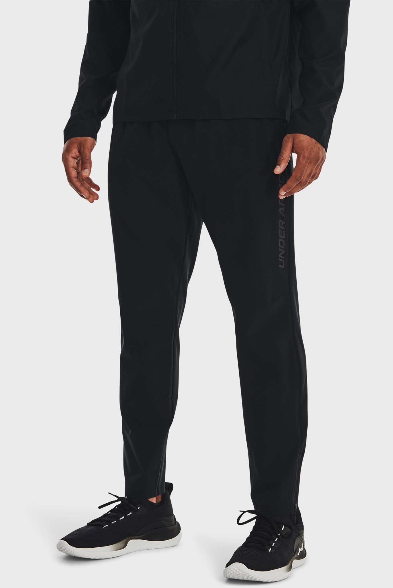 Чоловічі чорні спортивні штани UA STORM RUN PANT 1