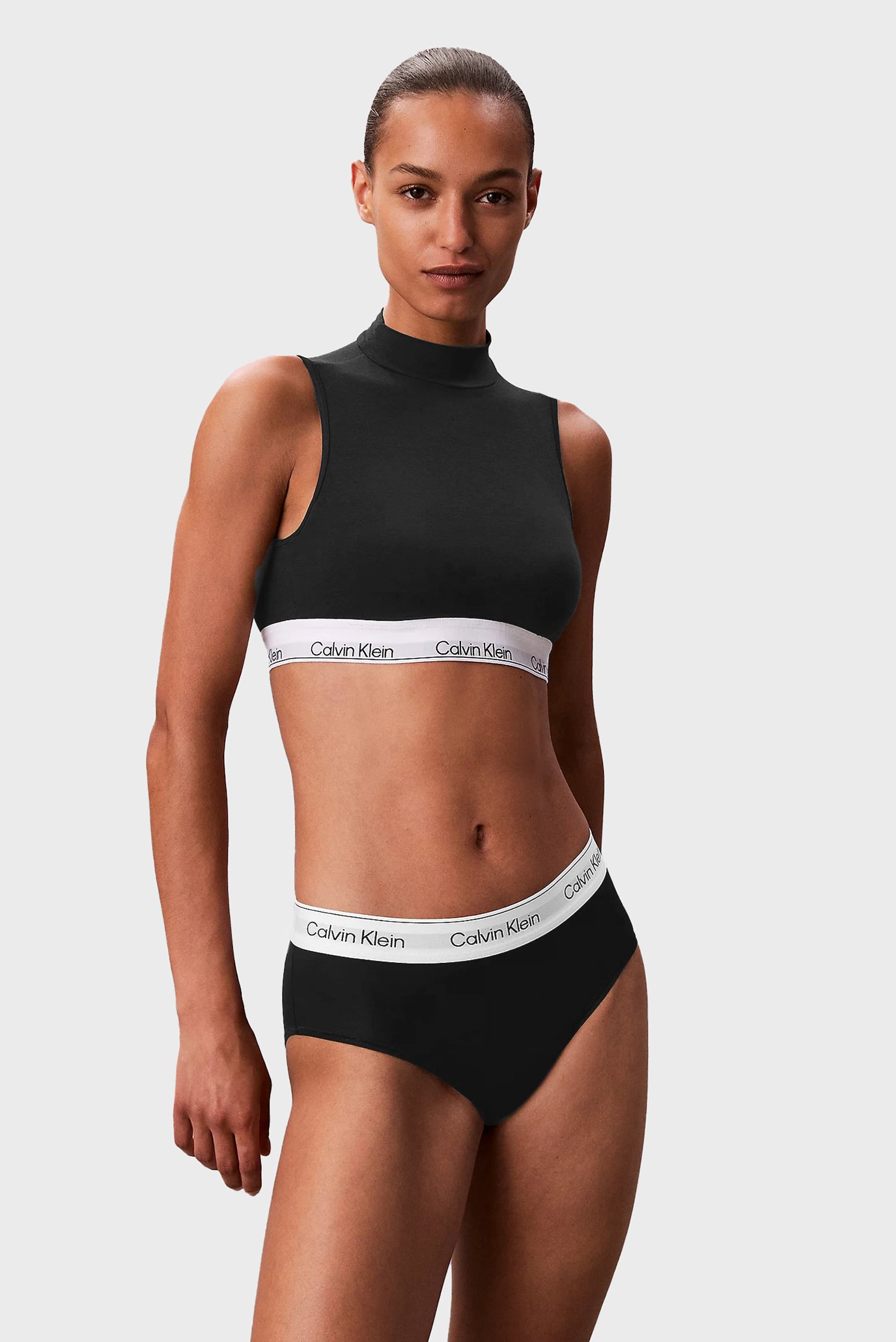 Женский черный топ LIGHTLY LINED MOCKNECK BRALETTE Черный L Calvin Klein LV00QF8383 Женский черный топ LIGHTLY LINED MOCKNECK BRALETTE Черный L Calvin Klein LV00QF8383