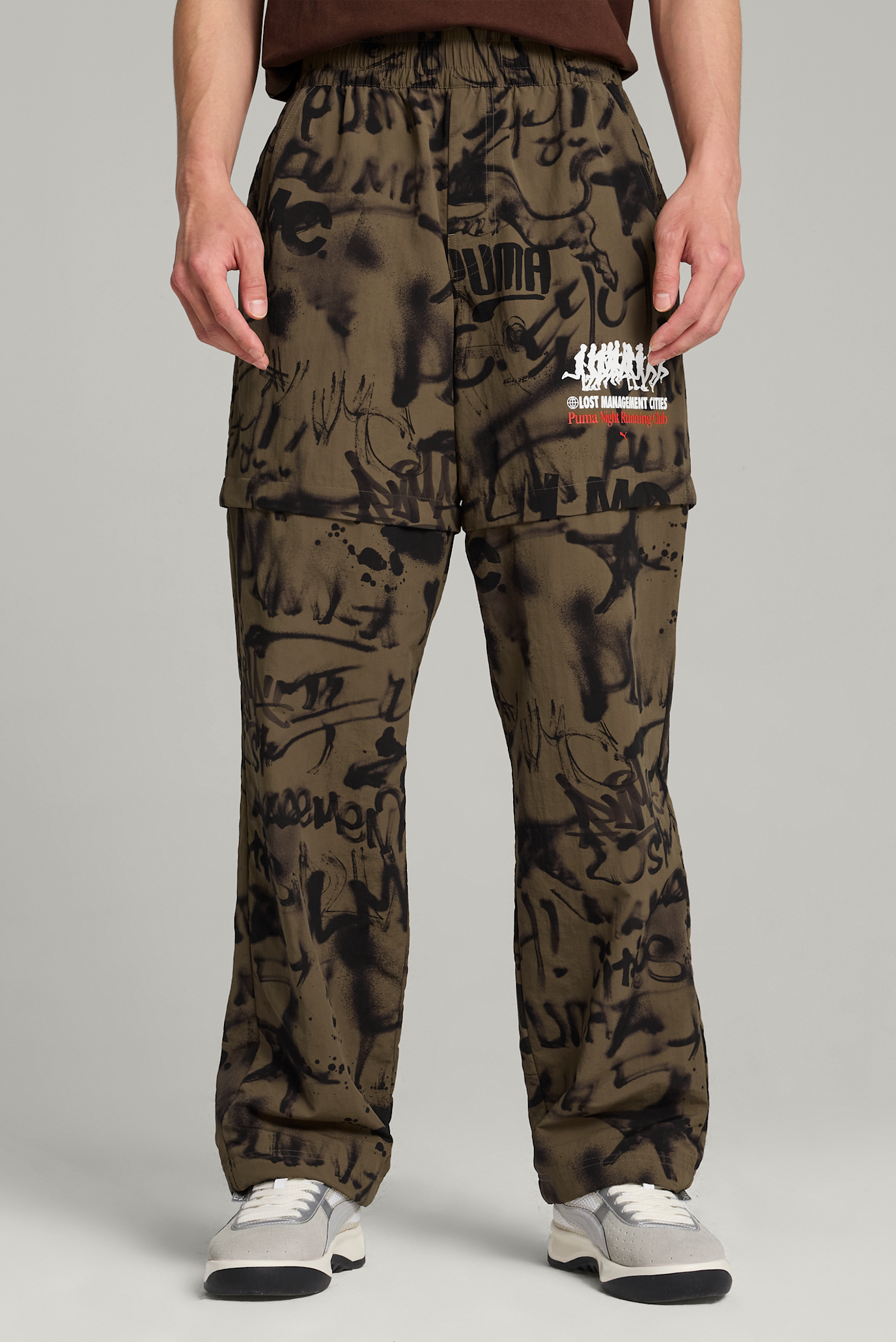 Мужские оливковые спортивные брюки с узором 2в1 PUMA x LMC All-over Print Pants Men 1