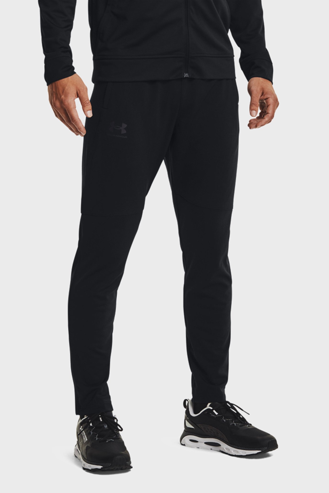 Чоловічі чорні спортивні штани UA PIQUE TRACK PANT 1