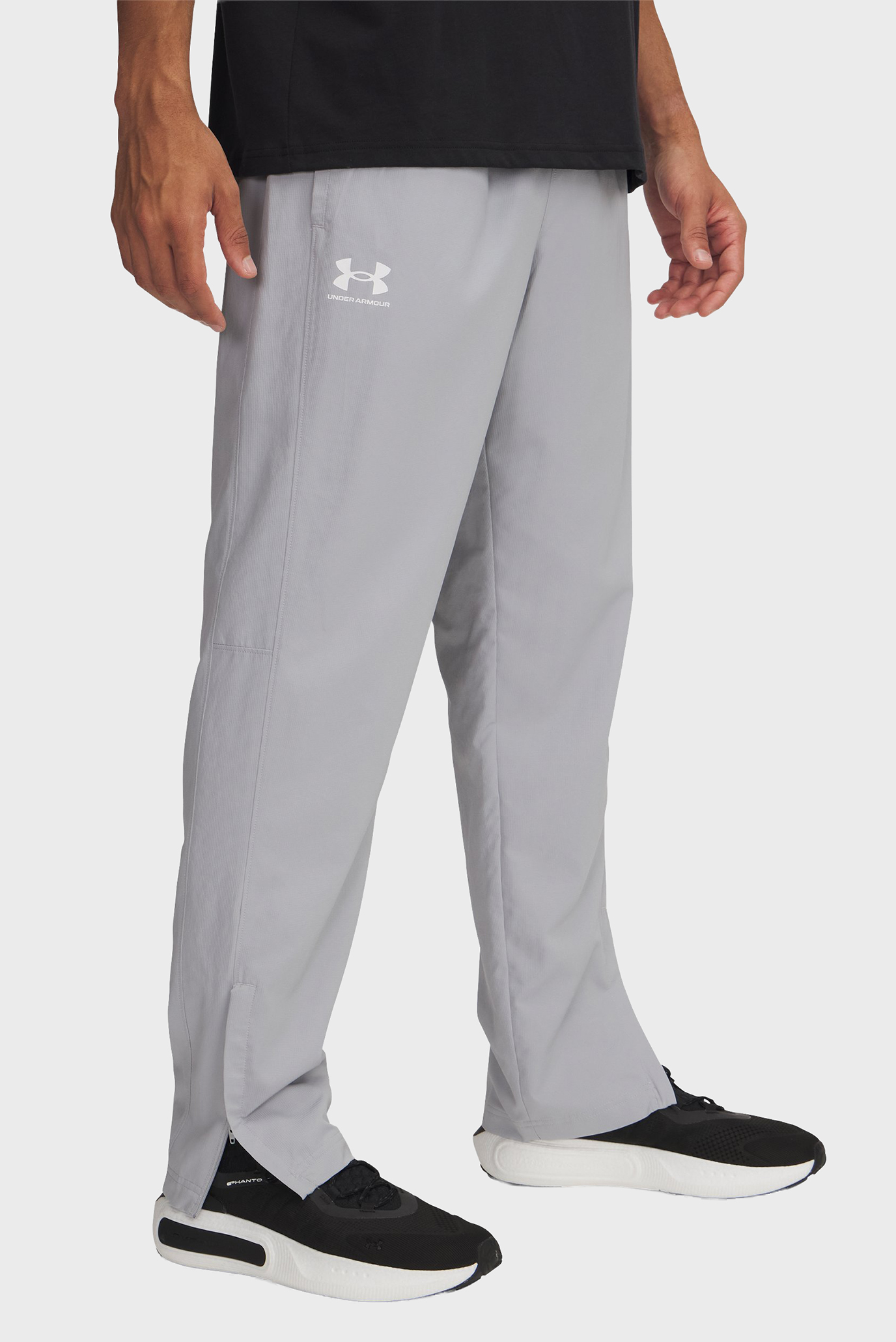 Мужские серые спортивные брюки UA Rival Wvn Windbreaker Pnt Серый S Under Armour 1390150-011 Мужские серые спортивные брюки UA Rival Wvn Windbreaker Pnt Серый S Under Armour 1390150-011