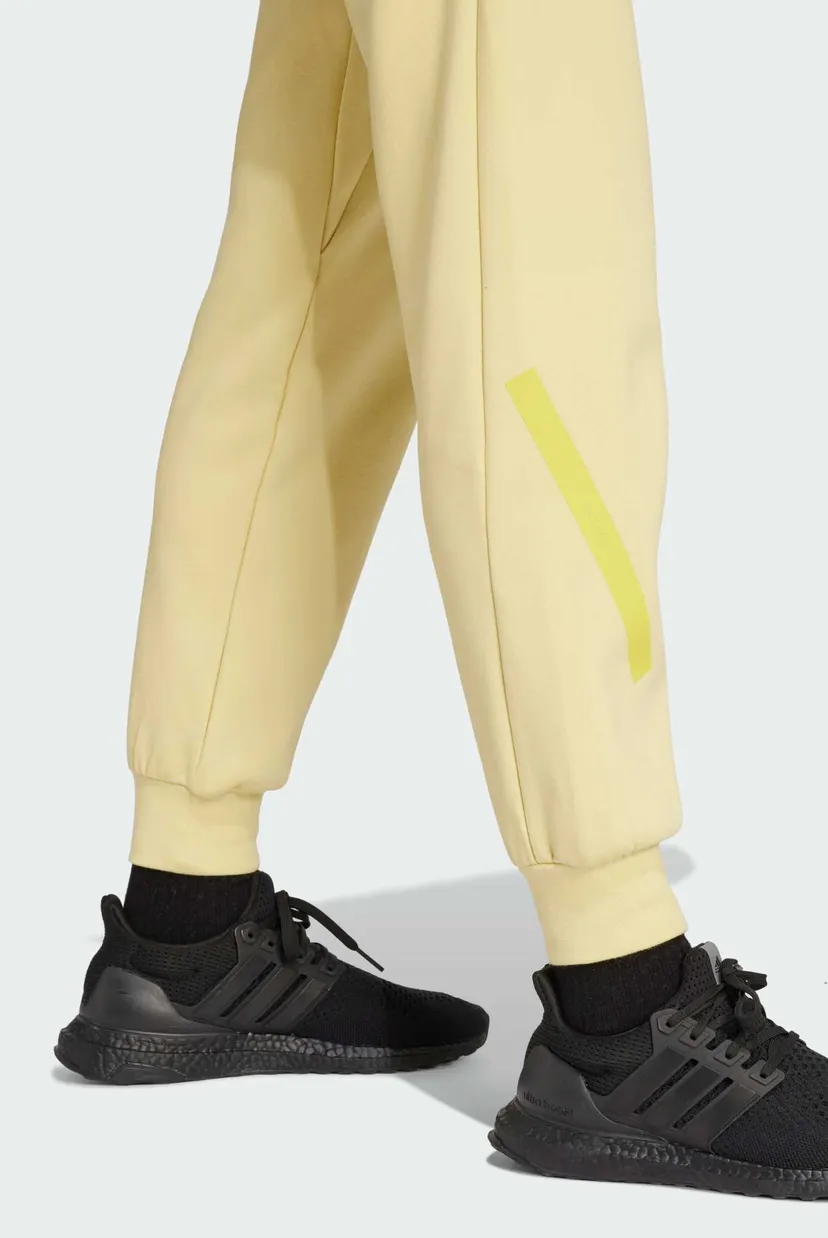 Женские желтые спортивные брюки adidas Z.N.E. 5