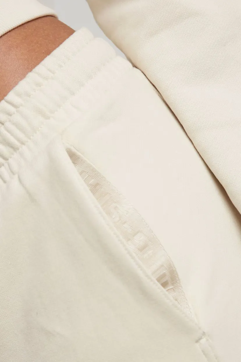 Жіночі бежеві спортивні штани Tape sw pant wmn 4