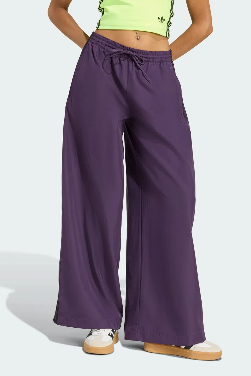 Жіночі фіолетові спортивні штани adicolor Firebird Oversized 1