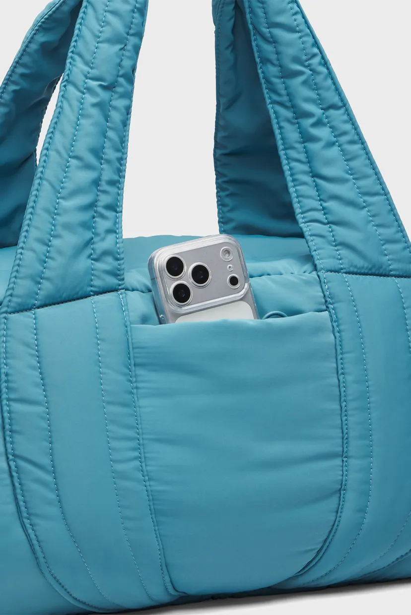 Женская голубая спортивная сумка UA Studio Soft Duffle 5