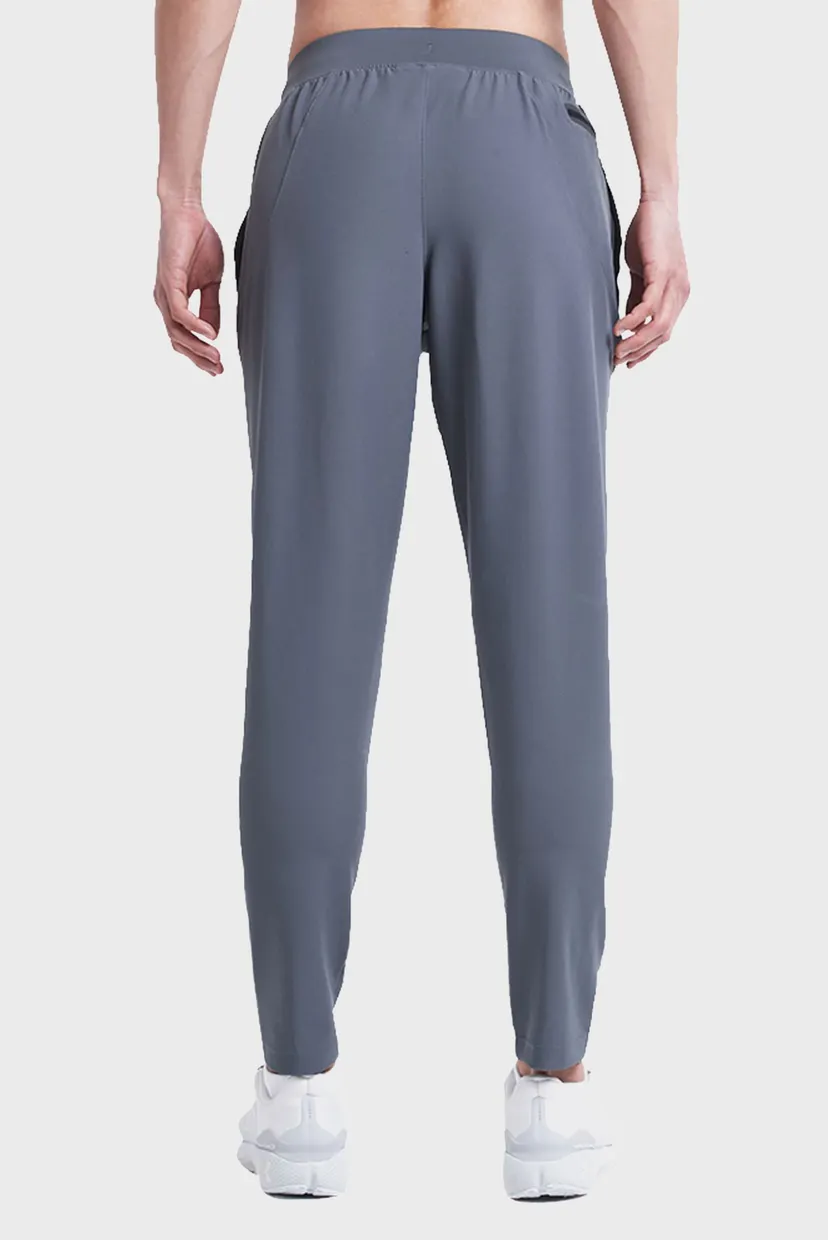 Мужские серые спортивные брюки UA UNSTOPPABLE TAPERED 3