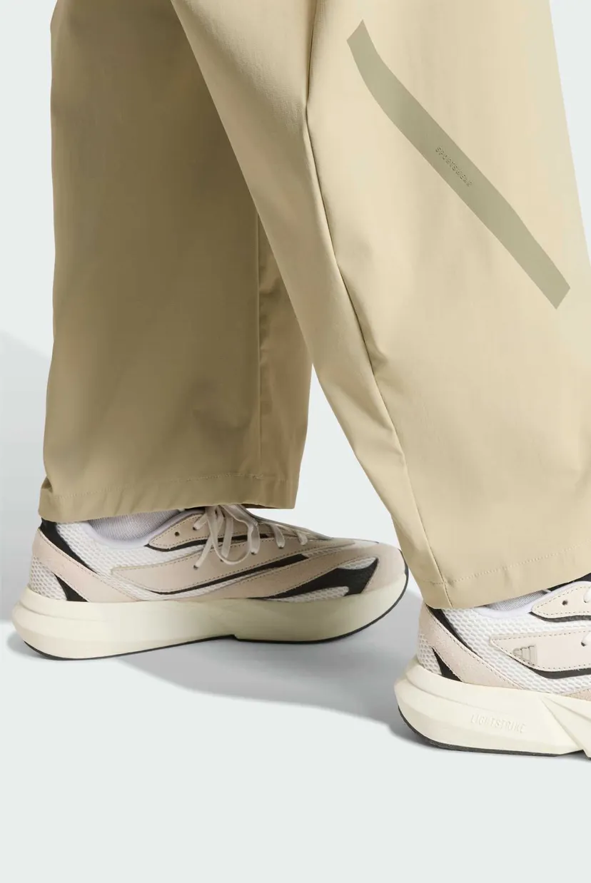 Жіночі бежеві спортивні штани ADIDAS Z.N.E. WOVEN 5