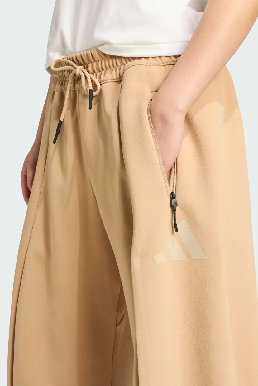 Женские бежевые спортивные брюки adidas Z.N.E. Open-Hem 4
