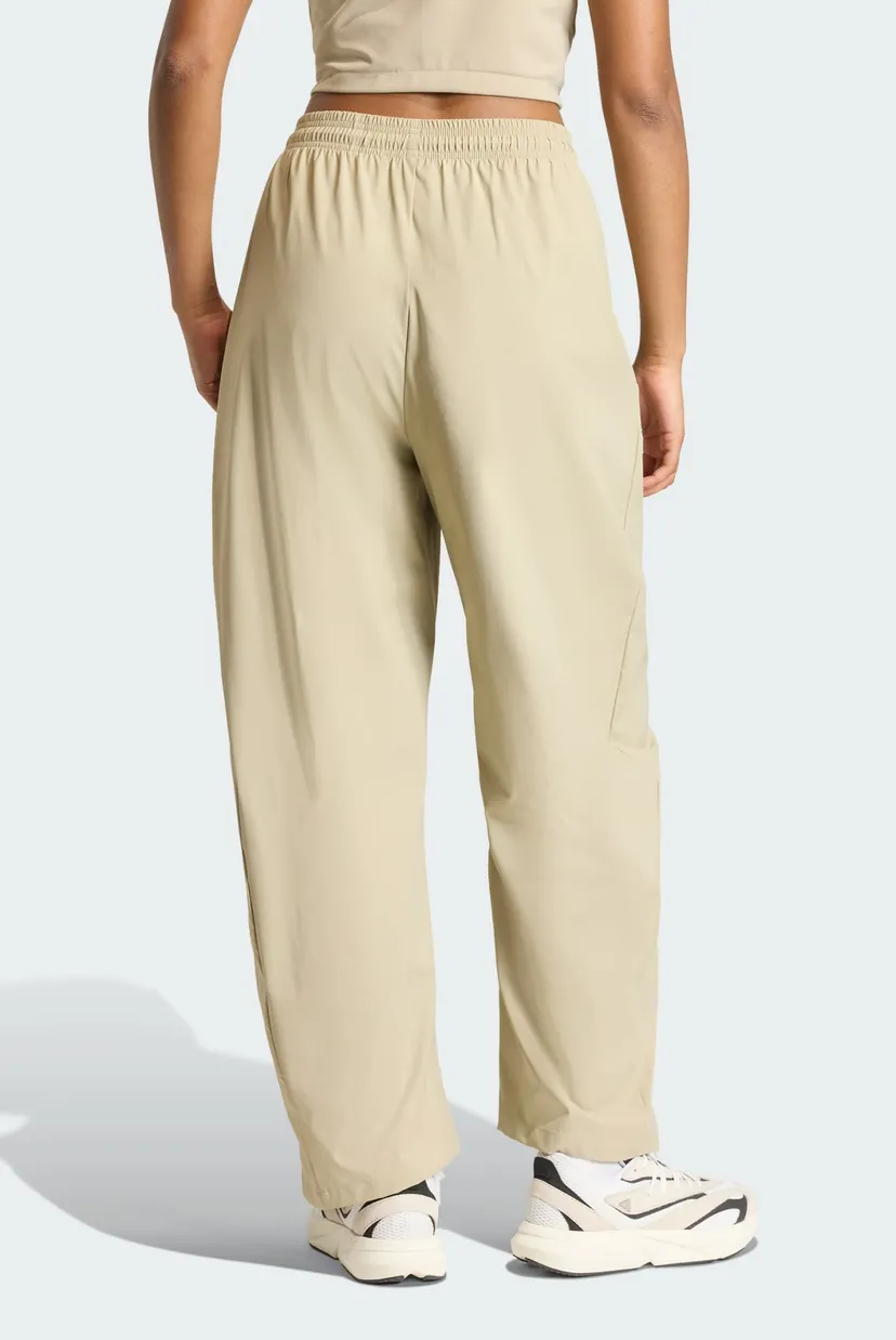 Женские бежевые спортивные брюки ADIDAS Z.N.E. WOVEN 3