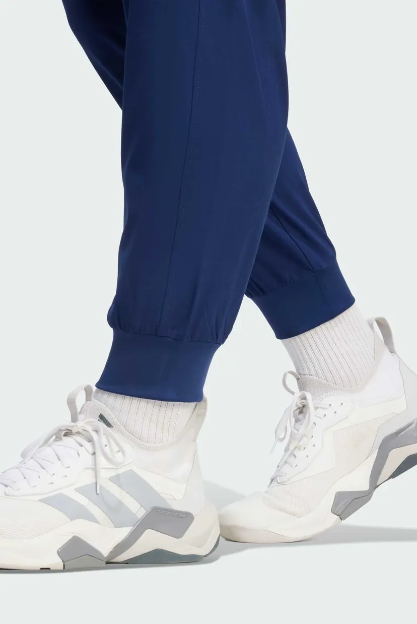 Чоловічі сині спортивні штани WORKOUT ESSENTIALS FLEX WOVEN 5