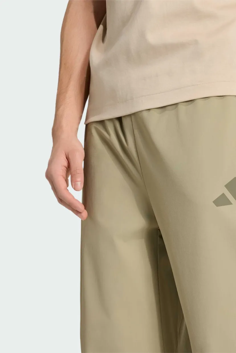 Чоловічі бежеві спортивні штани ADIDAS Z.N.E. WOVEN 4