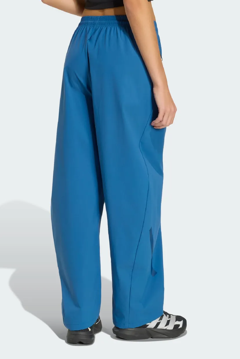 Женские синие спортивные брюки ADIDAS Z.N.E. WOVEN 3