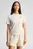 Жіноча бежева футболка adidas by Stella McCartney TrueCasuals Regular Sportswear