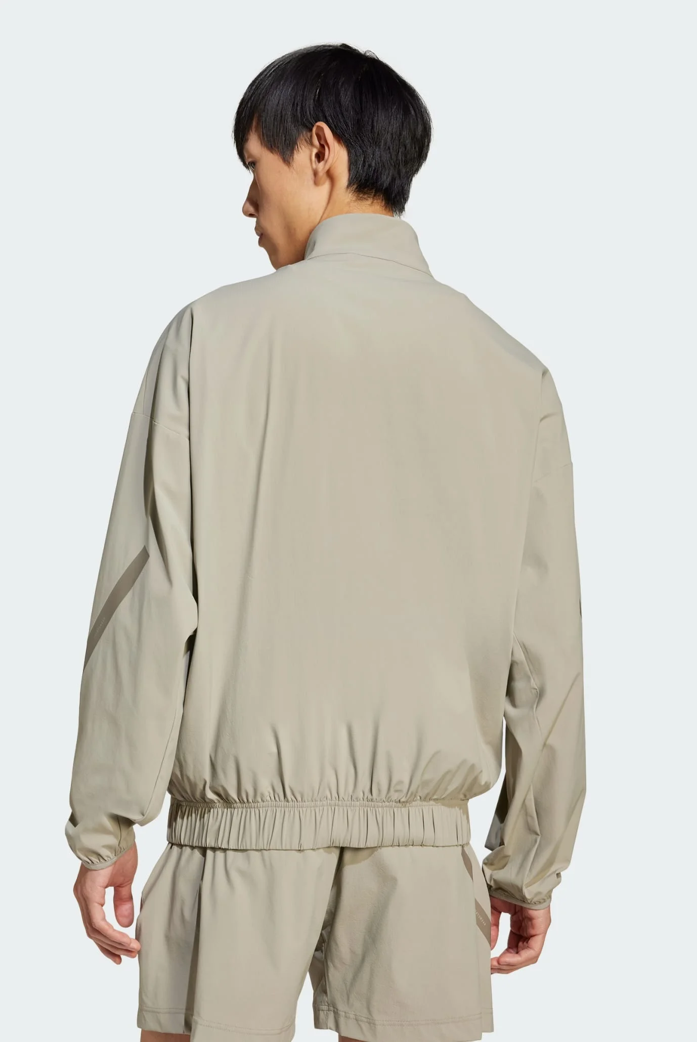 Мужская бежевая спортивная кофта adidas Z.N.E. Woven adidas JN9028