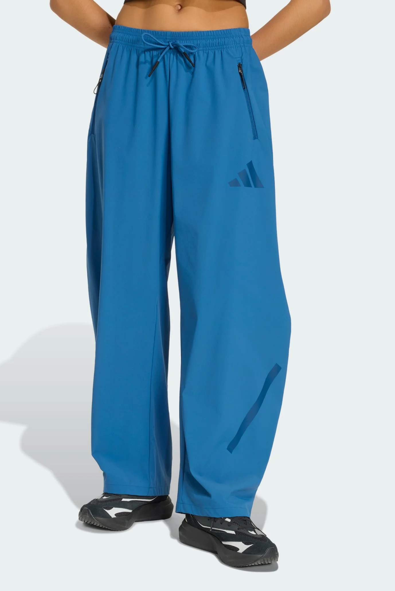 Женские синие спортивные брюки ADIDAS Z.N.E. WOVEN adidas KF0578